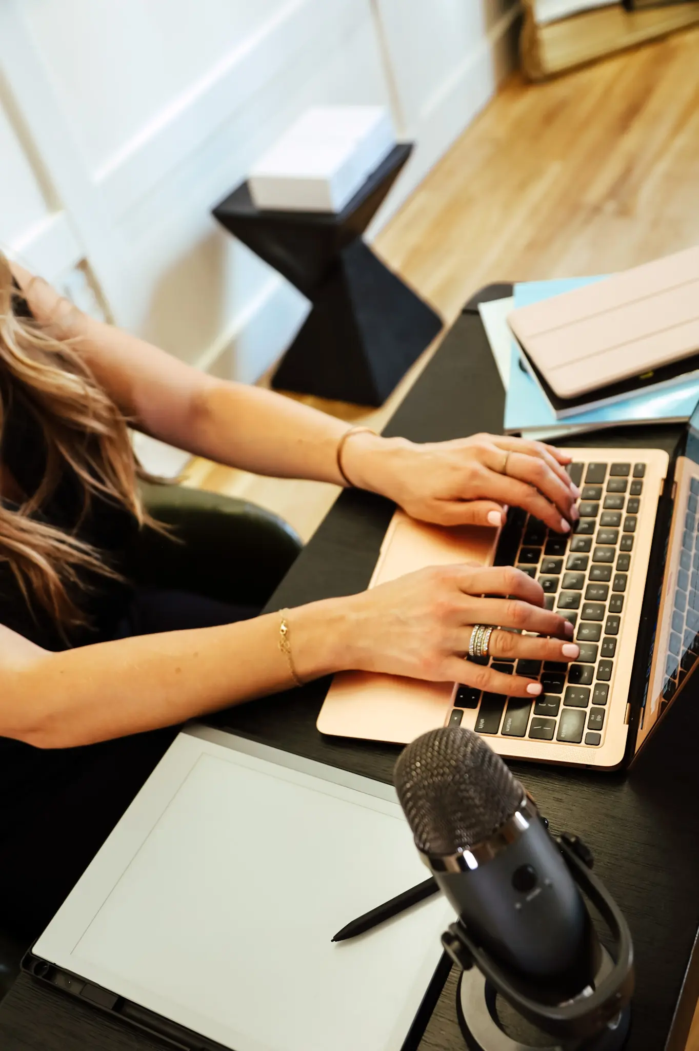 A person typing on a laptop computer.